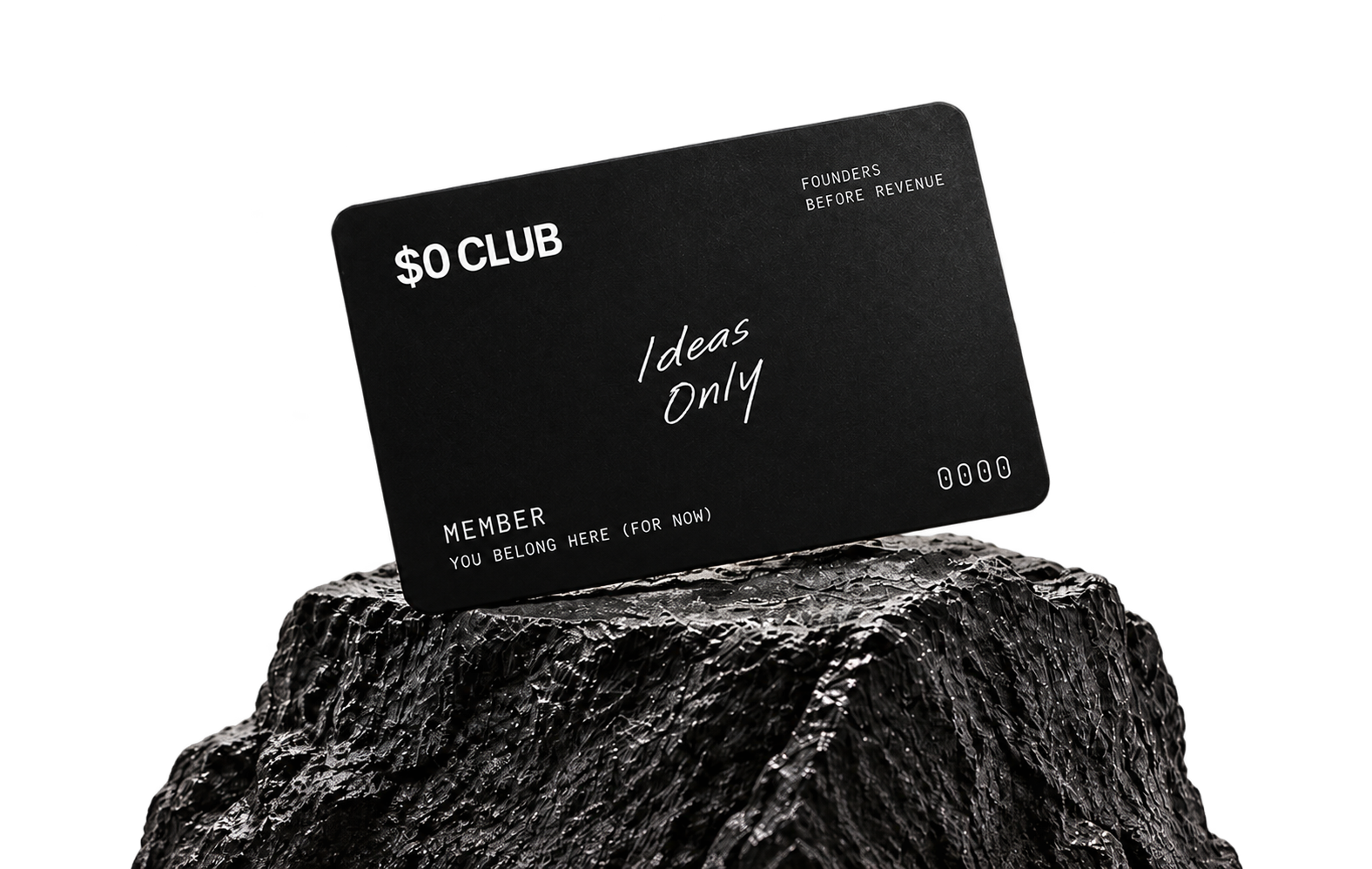The $0 Club membership card resting on a rock